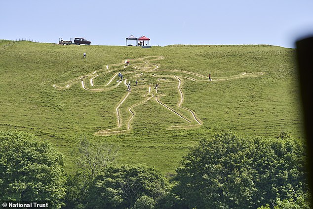 Experts restore Britain's iconic Cerne Abbas Giant with 17 tonnes of chalk.